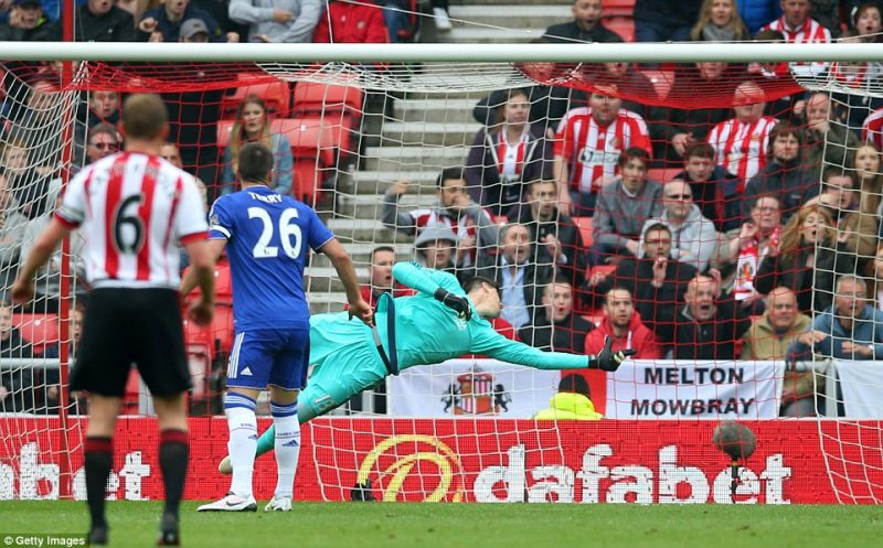 Chelsea goalkeeper Thibaut Courtois can't land a glove on Khazri shot