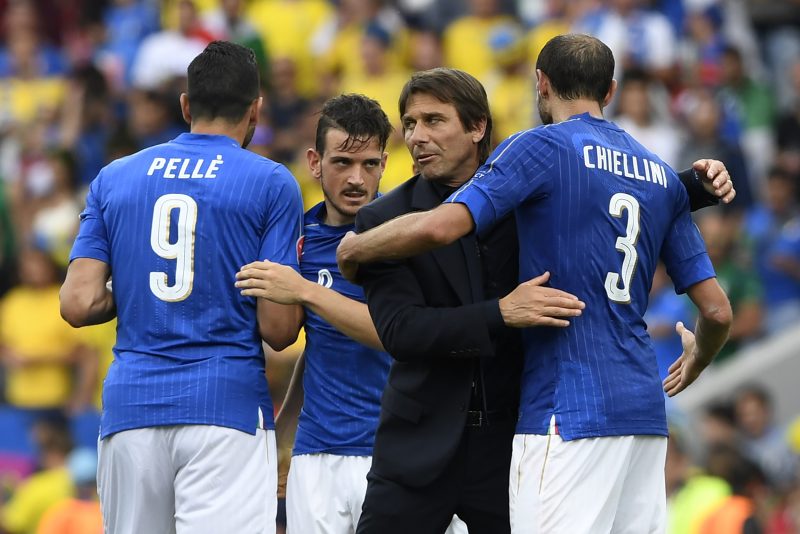Antonio Conte congratulating Giorgio Chiellini after Italy's 1-0 win over Sweden in EURO2016. (Photo credit should read JONATHAN NACKSTRAND/AFP/Getty Images)